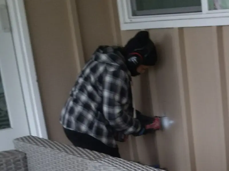 Professional electrician installing an exterior outlet in Wonder Lake